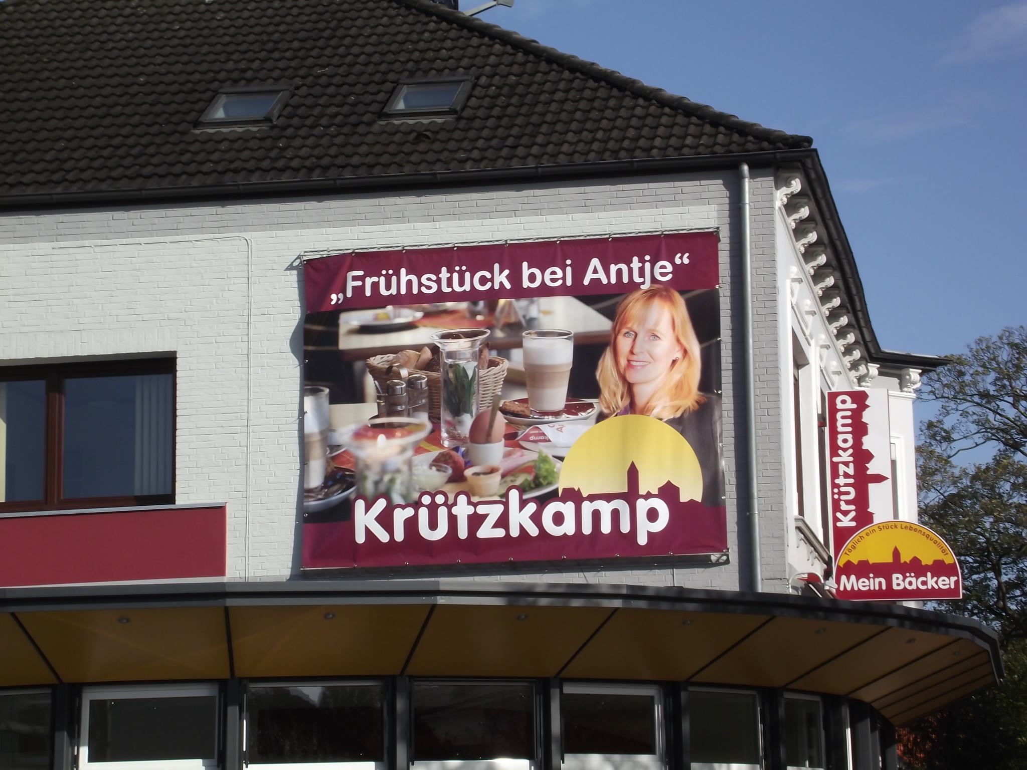 Bäckerei Konditorei Krützkamp in Delmenhorst - Werbeplakat an der Hauswand