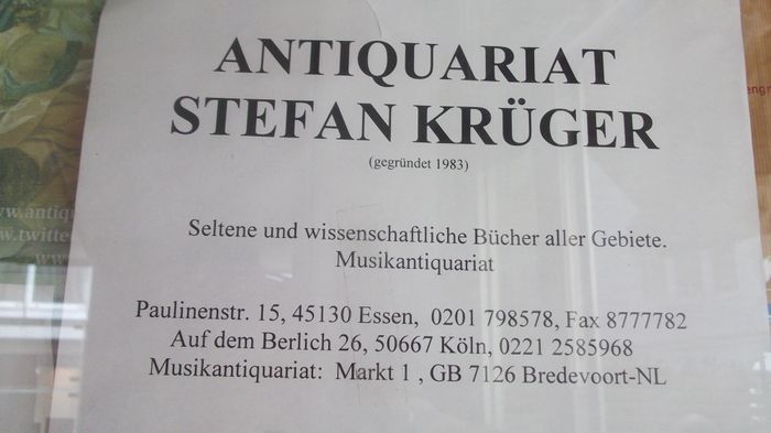 Namenszettel mit den verschiedenen Adr. des Antiquariats