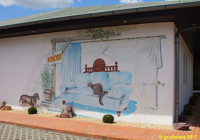 Wandbild als Außenwerbung am Geschäft der Möbelpolsterei Krost